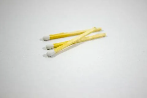 Angled close-up shot of random spreaded multiple white match head covered mat Stock Photos
