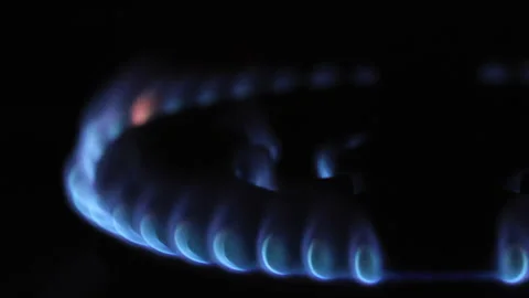 Angled Close-Up View Of A Gas Burner With Its Characteristic Blue Flames Against Video stock 315358526