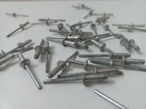 Angled Close Up View of Metallic Pop Rivets Stock Photos