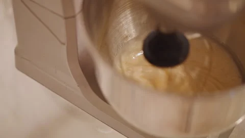 Angled closeup mixer stirring pumpkin pie, thick glossy texture with spice notes Stock Footage 348301210