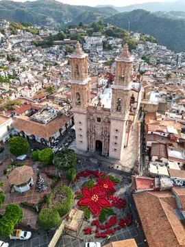 Angled drone view of Santa Prisca church in Taxco with plaza and flower design Fotos de archivo