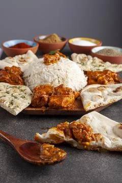 Angled image of a gourmet mixture of indian dishes including rice, naan, tikk Stock Photos