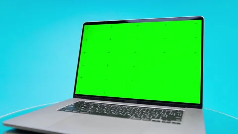 Angled Laptop Green Screen Mockup on Blue Stock Footage 335687019