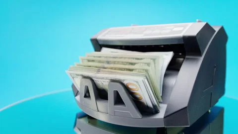 Angled Money Counter Checking Dollars on Blue Stock Footage 347645011