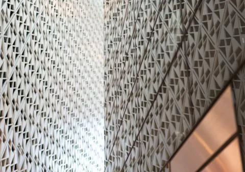 Angled pattern on the facade of a modern architecture building Stock Photos