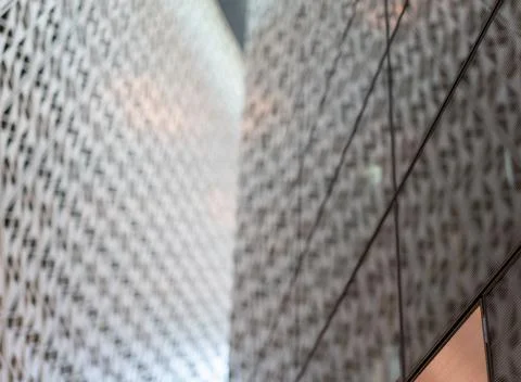 Angled pattern on the facade of a modern architecture building Stock Photos