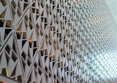 Angled pattern on the facade of a modern architecture building Stock Photos