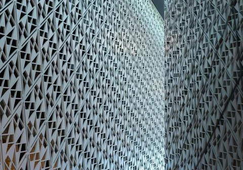 Angled pattern on the facade of a modern architecture building Stock Photos