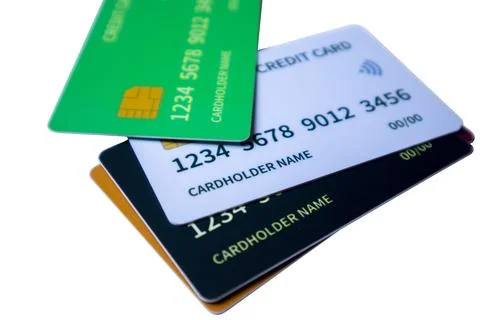 Angled perspective of overlapping multi-colored credit and debit cards on a.. Stock Photos