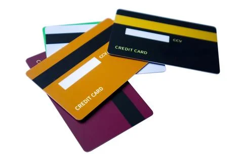 Angled perspective of overlapping multi-colored credit and debit cards show.. Stock-Fotos