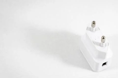 Angled shoot of white colored mobile phone charge adapter Stock Photos