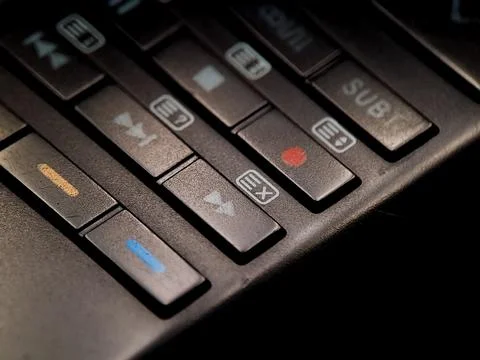 Angled shot shows various control buttons with colored and labeled icons in.. Stock Photos