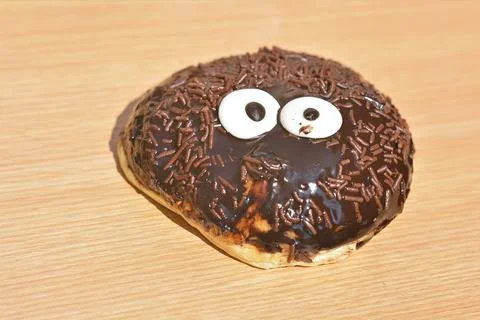 Angled Side View of Chocolate Monster Donut Фото