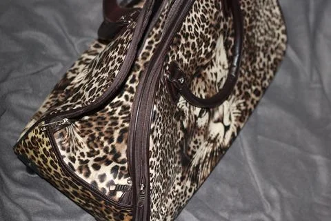 Angled Side View of Leopard Print Duffel Bag with Zippers Stock Photos