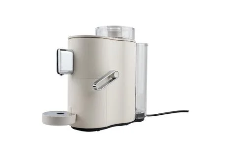 Angled side view of a sleek countertop coffee machine with chrome elements and Foto stock