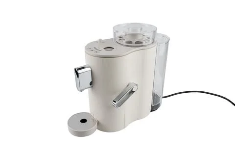 Angled side view of a sleek countertop coffee machine with chrome elements and Stock Photos