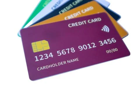 Angled stack of colorful credit cards featuring purple, orange, dark blue, .. Stock Photos
