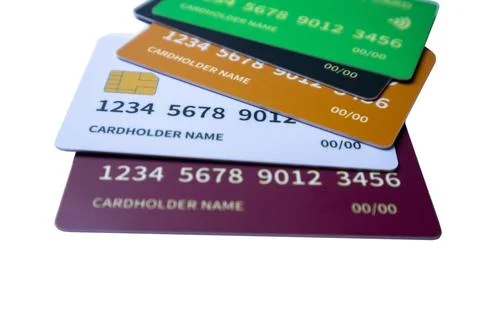 Angled stack of multi-colored credit and debit cards on a white background Stock Photos