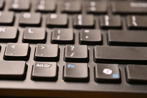 Angled Top View Macro Close-Up Black Computer Keyboard Highlighting Slash a.. Stock-Fotos