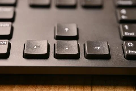 Angled Top View Macro Close-Up Black Keyboard Highlighting Down Arrow Key w.. Foto stock