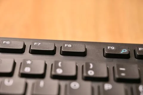 Angled Top View Macro Close-Up Black Computer Keyboard Highlighting F8 Func.. Stock Photos