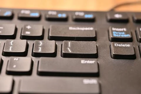 Angled Top View Macro Close-Up Black Computer Keyboard Highlighting Backsla.. 스톡 사진
