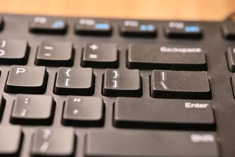 Angled Top View Macro Close-Up Black Computer Keyboard Highlighting Closing.. 库存照片