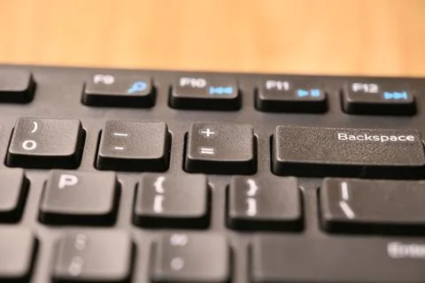 Angled Top View Macro Close-Up Black Computer Keyboard Highlighting Equals .. Stock Photos