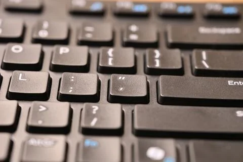 Angled Top View Macro Close-Up Black Computer Keyboard Highlighting Apostro.. 库存照片