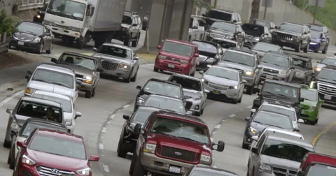 Angled view of approaching northbound traffic on 110 freeway in LA 4K Stock Footage 63645239