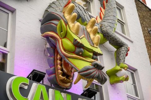 Angled view close up of Elaborately decorated shop front with dragon artwork  Foto stock