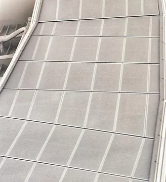 Angled view of a concrete wall featuring a geometric pattern with rectangular Fotos de archivo
