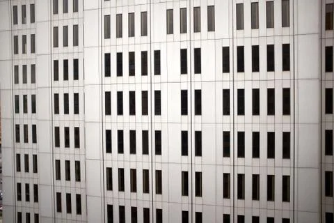 Angled view of concrete wall of skyscraper Stock Photos