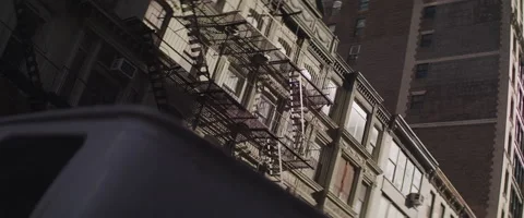 Angled View of a Fire Escape on a New York Apartment Building Stock Footage 208760301
