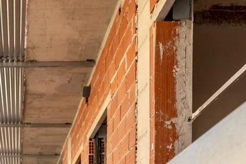 Angled view inside a construction site showing exposed brickwork, concrete slabs Stock Photos