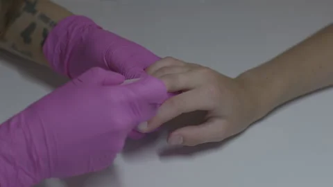 Angled view of manicure perfromed on young woman's hand Vídeos de archivo 231355540
