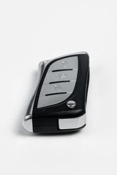 Angled View of Modern Car Key Fob Remote Control on White Background Stock Photos