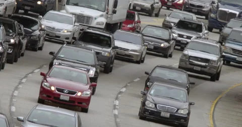 Angled view of northbound traffic approaching on 110 freeway in LA 4K Stock Footage 63644008