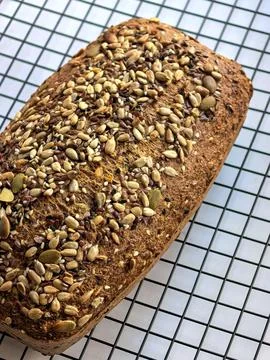 Angled View Of Seeded Keto Bread On Cooling Rack Stock Photos