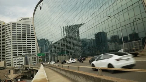Angled view of Sydney traffic and The Ribbon Hotel 6K Stock Footage 301674834