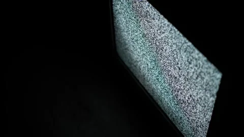 Angled View of TV Screen Displaying Analog Static Noise Stock Footage 307554882