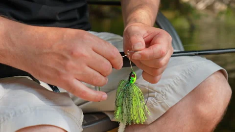 Angler attached perch spinner spoon blade with plastic paddle tail bait lur.. Stock Footage 327669324