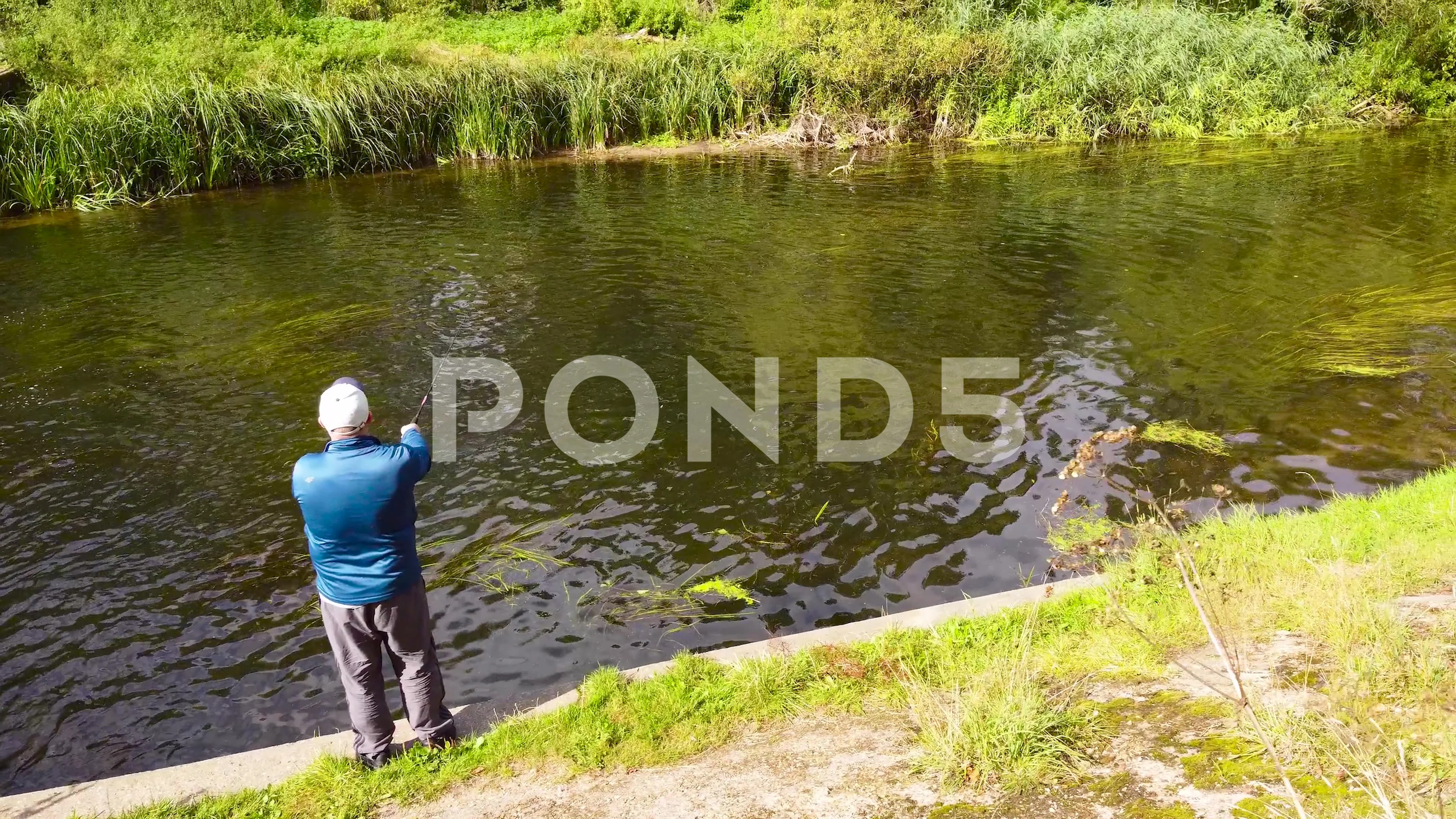 https://images.pond5.com/angler-casting-fishing-line-over-footage-164215786_prevstill.jpeg