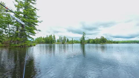Angler casting rod with artificial baitfish lure for big mouth bass in the .. Video stock 291454994