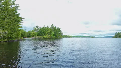 Angler casting rod with artificial baitfish lure for big mouth bass in the .. Video stock 291459766