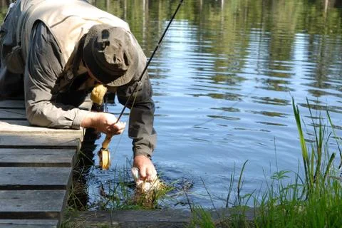 Angler with a catch Stock Photos