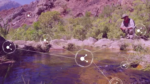 Angler crouching handling rod, node appearing, starting linking nodes across Stock Footage 333169998
