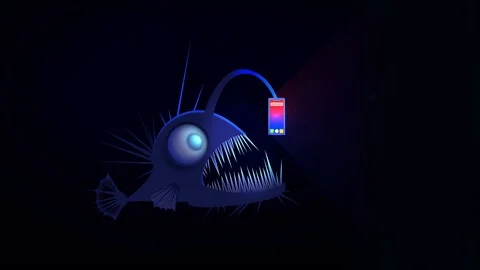 Angler fish using smartphone as a lure. 库存影片 108873041