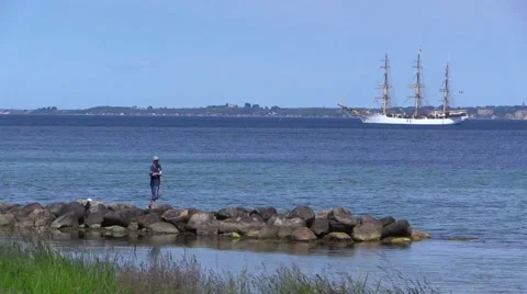 Angler in front of training ship Danmark in the Sound Øresund Video stock 50970352
