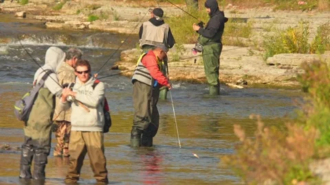 Anglers using bobber or float for salmon and trout. Fishermen in waders sta.. Stock Footage 293861482